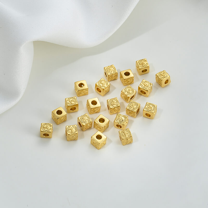 Gold wheel spacer beads, copper coin spacer, cylindrical barrel beads, lion awakening beads