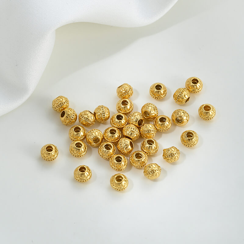 Gold wheel spacer beads, copper coin spacer, cylindrical barrel beads, lion awakening beads
