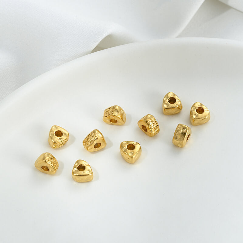 Gold wheel spacer beads, copper coin spacer, cylindrical barrel beads, lion awakening beads