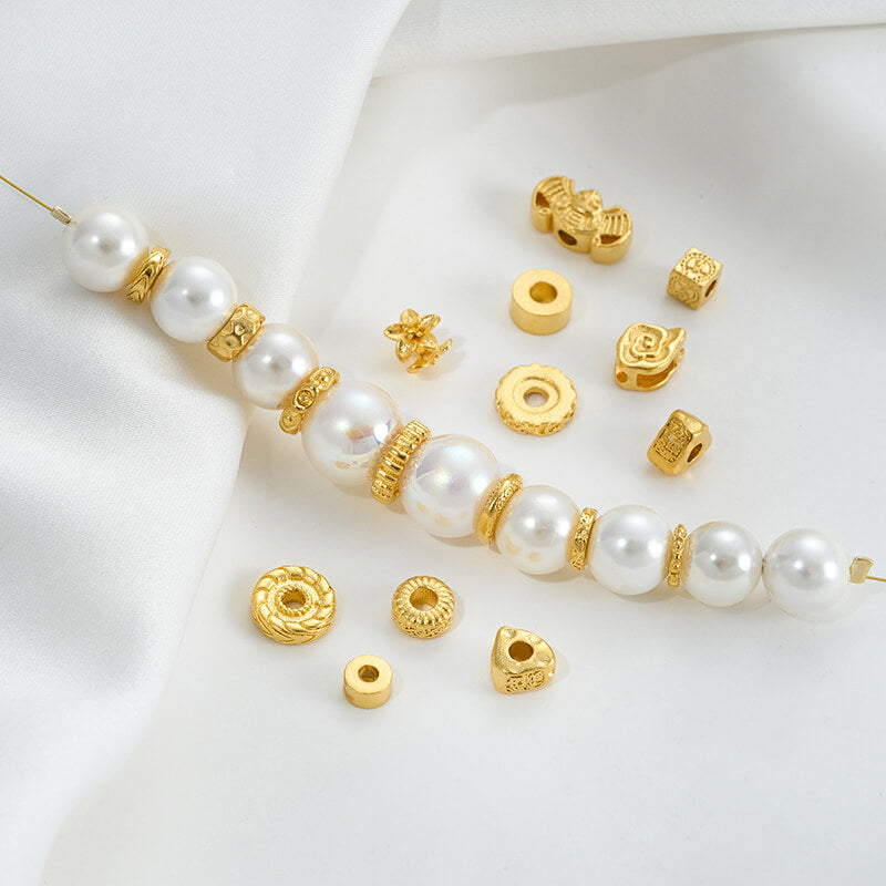 Gold wheel spacer beads, copper coin spacer, cylindrical barrel beads, lion awakening beads