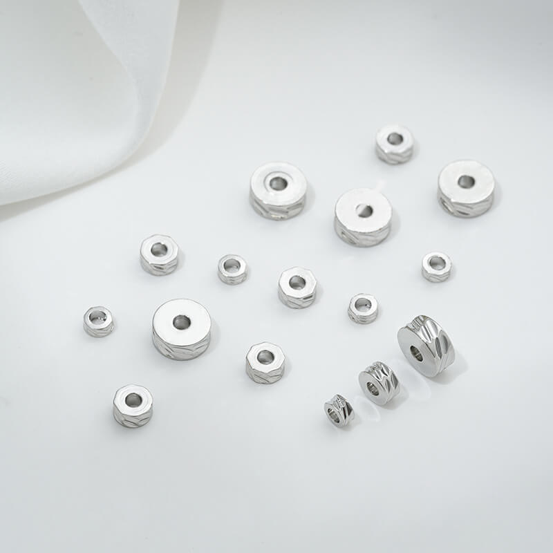 Cut-faced flat sheet spacer beads