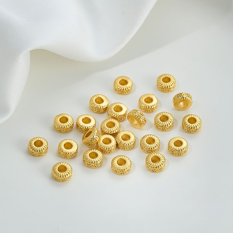 Gold wheel spacer beads, copper coin spacer, cylindrical barrel beads, lion awakening beads