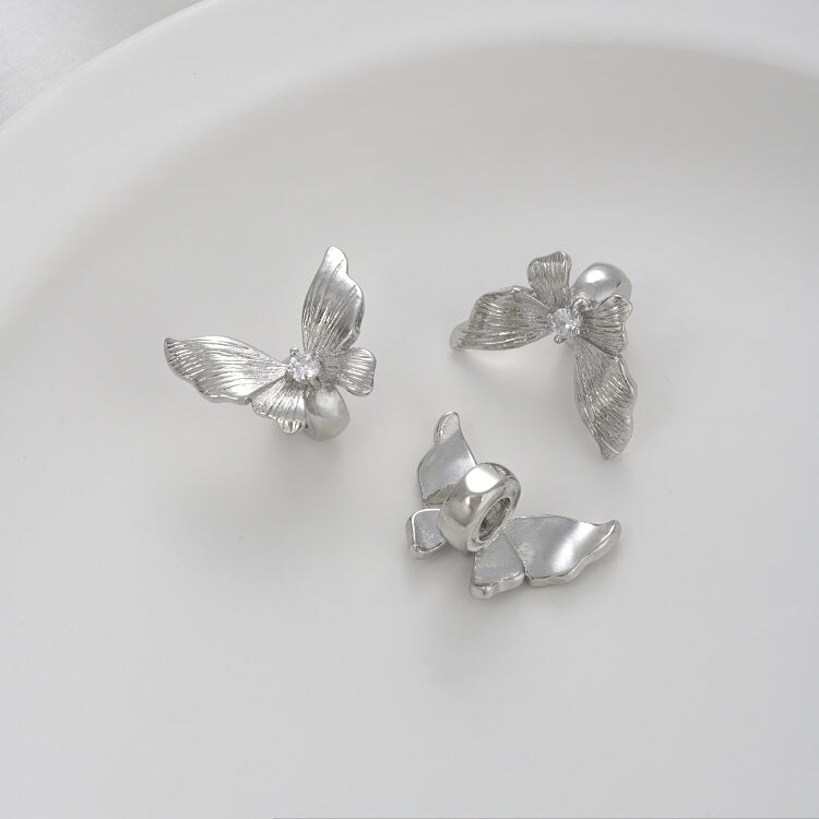 Zirconium-inlaid butterfly spacer beads with holes