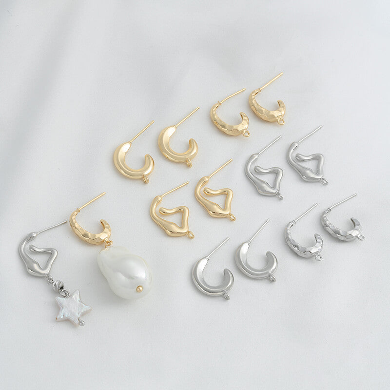 C-shaped lava earrings with hanging rings and diamond-faced earrings