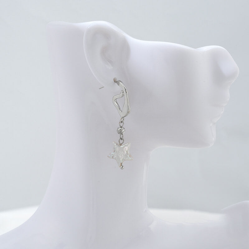 C-shaped lava earrings with hanging rings and diamond-faced earrings