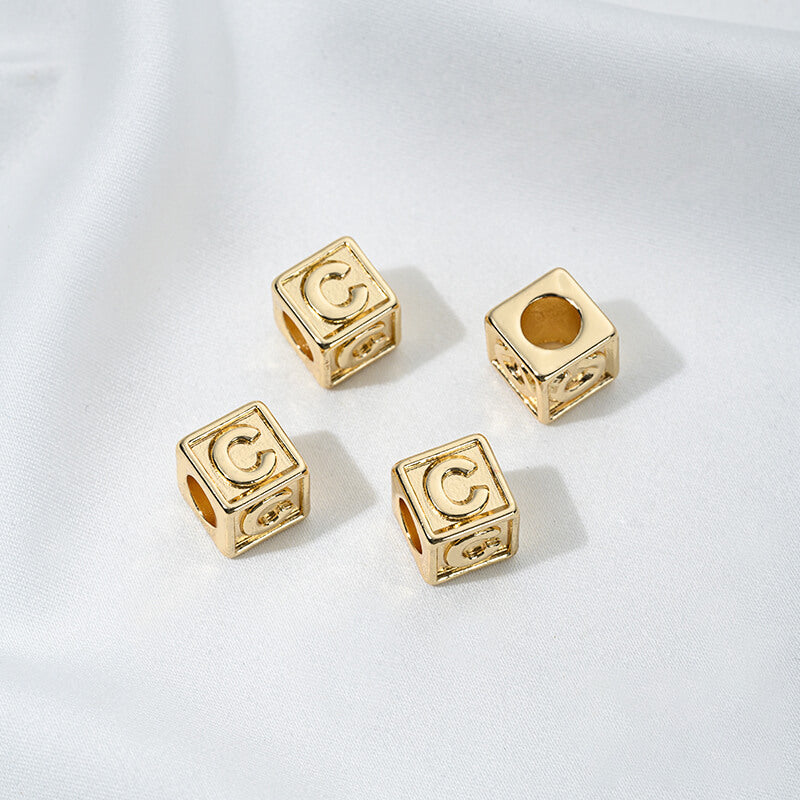 Titanium steel with gold-plated 26 letters square through-hole relief spacer
