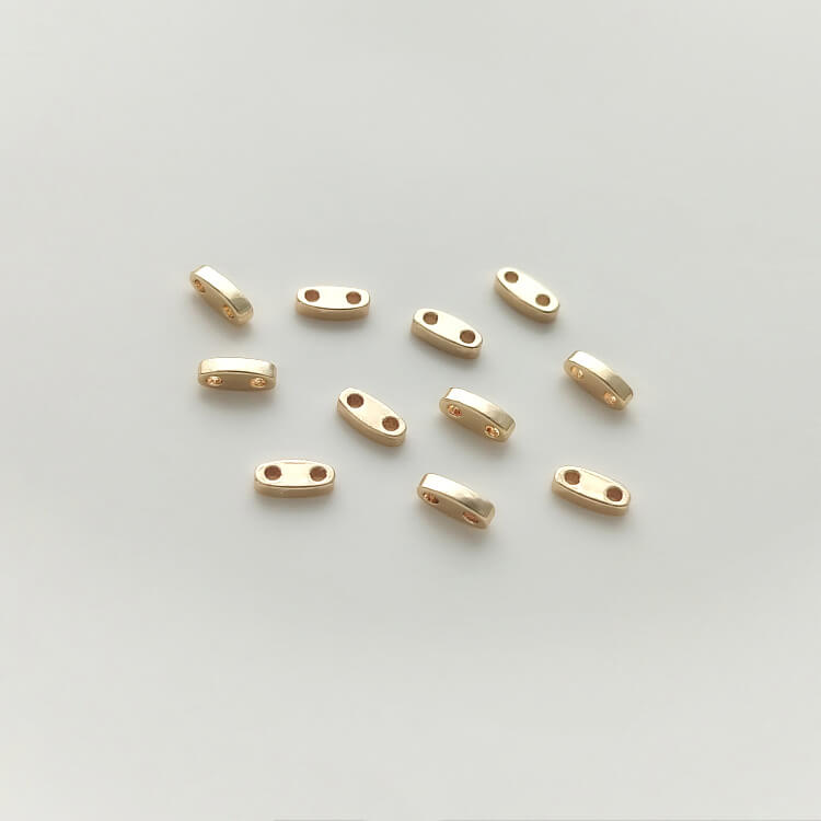 Double hole millet bead spacer