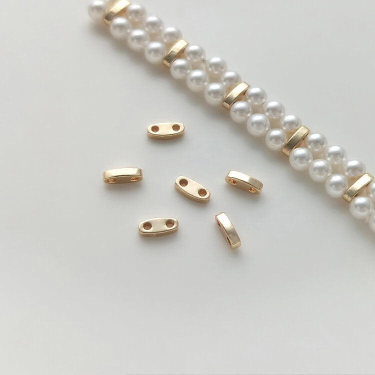 Double hole millet bead spacer