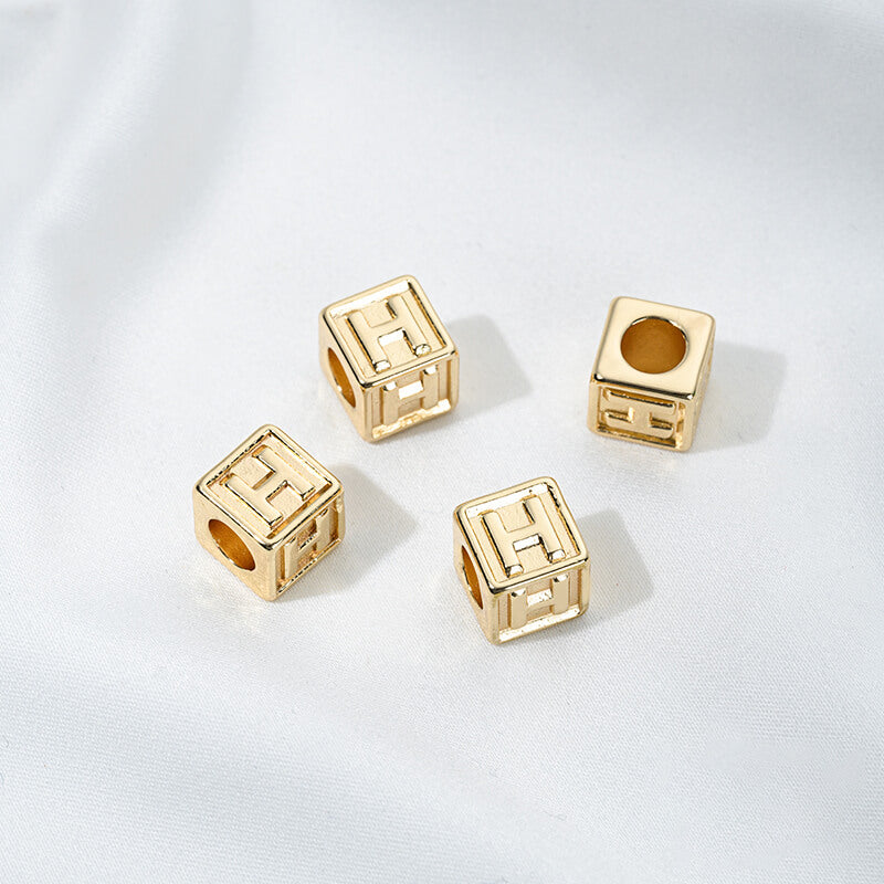 Titanium steel with gold-plated 26 letters square through-hole relief spacer