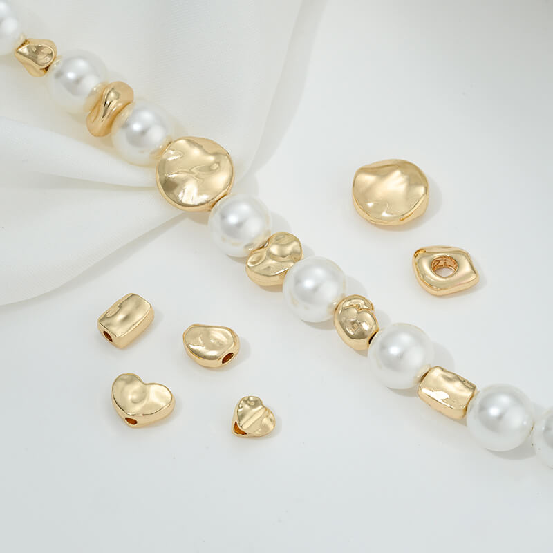 Irregular heart-shaped perforated spacer beads