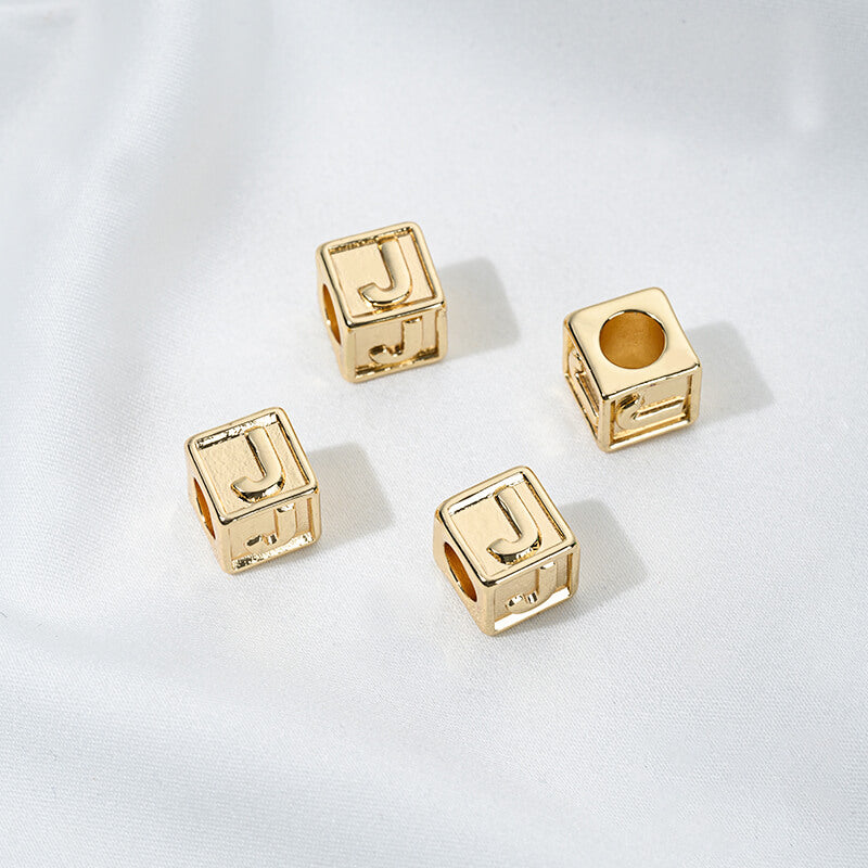 Titanium steel with gold-plated 26 letters square through-hole relief spacer