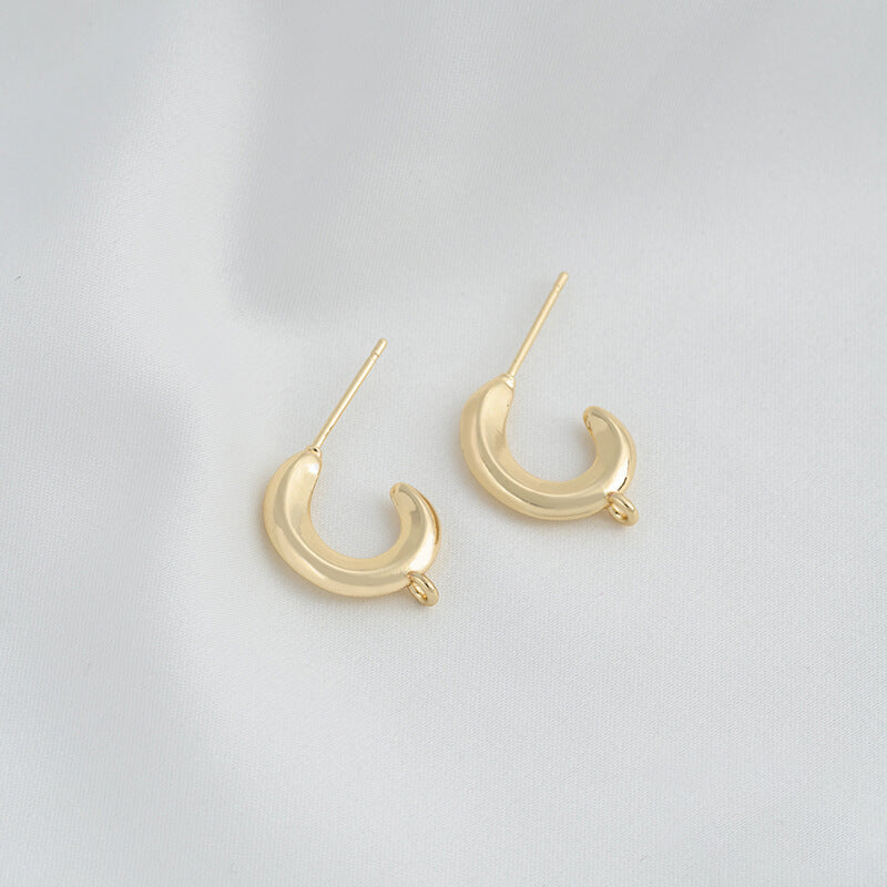 C-shaped lava earrings with hanging rings and diamond-faced earrings