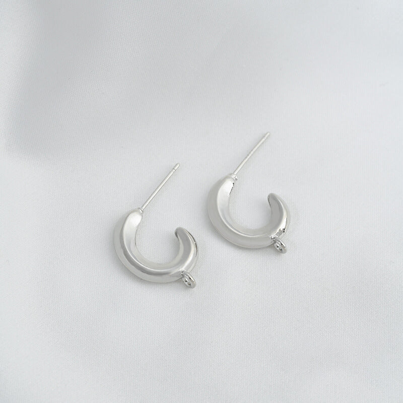 C-shaped lava earrings with hanging rings and diamond-faced earrings