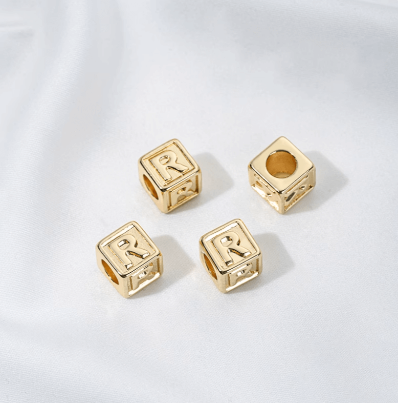 Titanium steel with gold-plated 26 letters square through-hole relief spacer