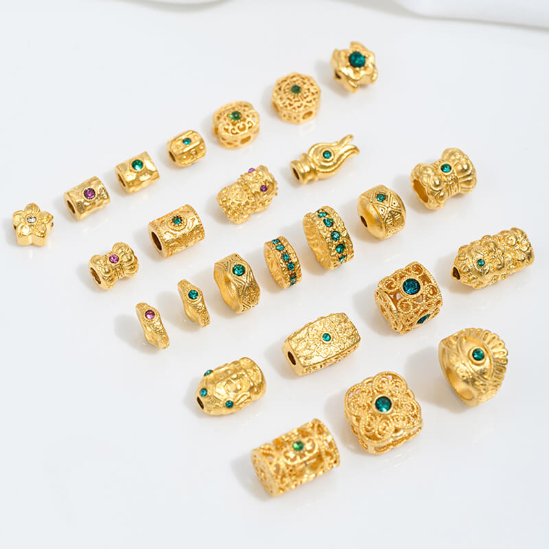 Sand gold inlaid with ruby and green diamonds, spacer beads