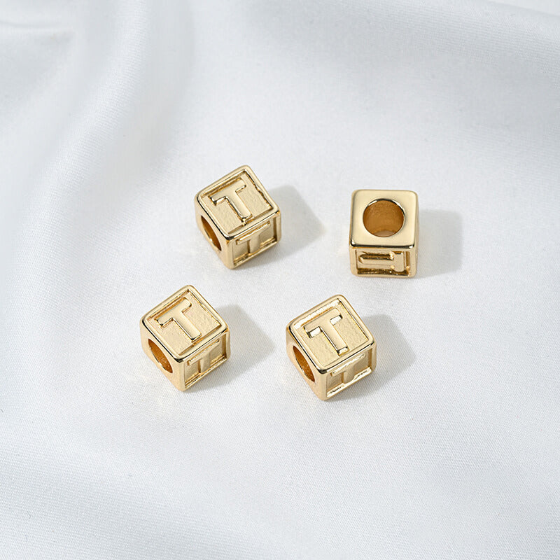 Titanium steel with gold-plated 26 letters square through-hole relief spacer