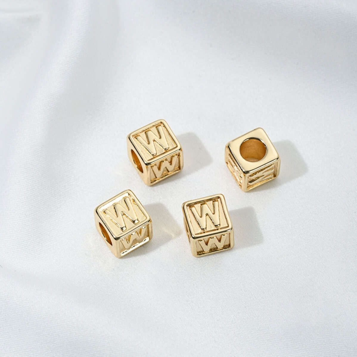 Titanium steel with gold-plated 26 letters square through-hole relief spacer