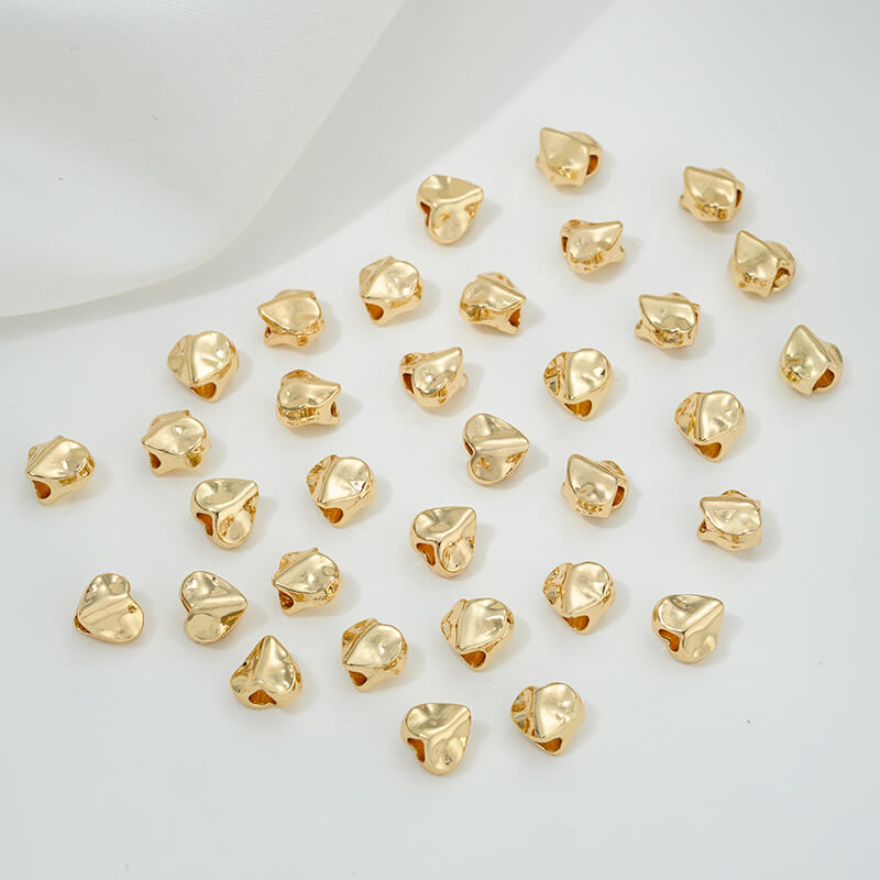 Irregular heart-shaped perforated spacer beads