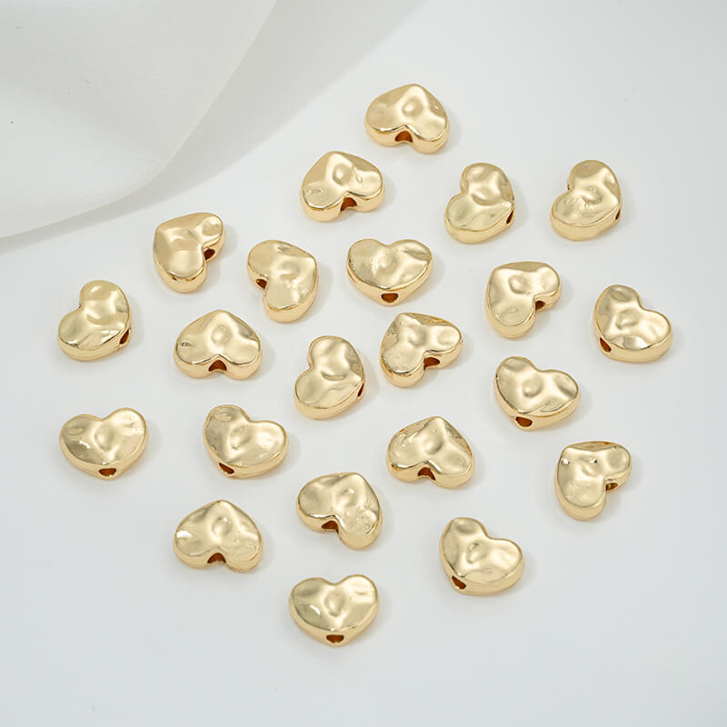Irregular heart-shaped perforated spacer beads