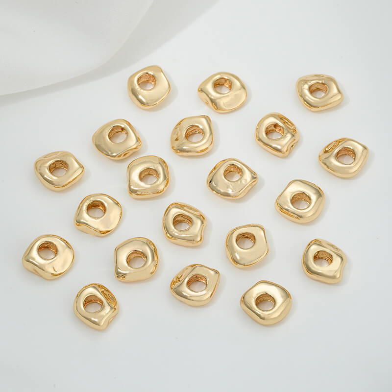 Irregular heart-shaped perforated spacer beads