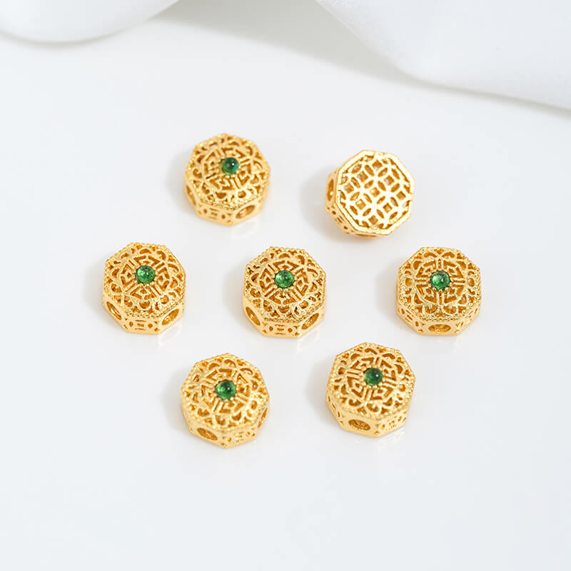 Sand gold inlaid with ruby and green diamonds, spacer beads