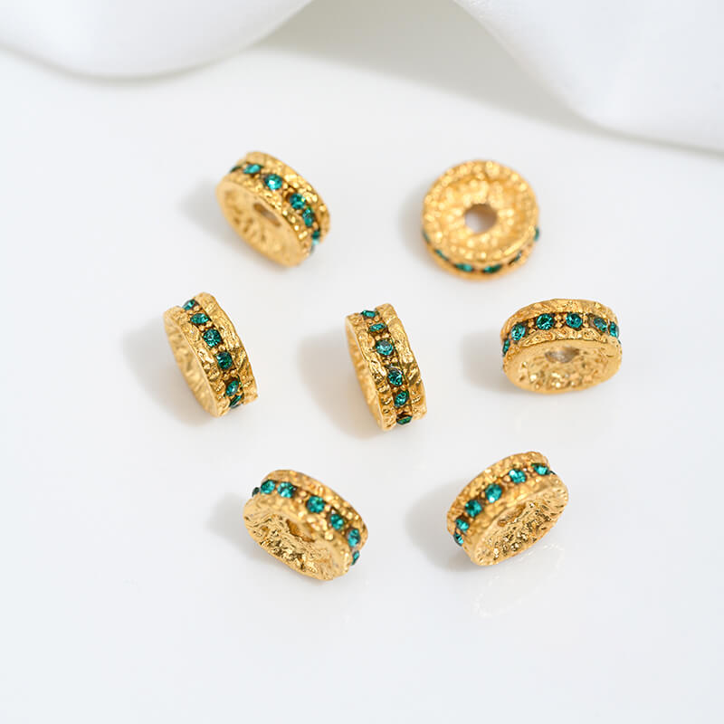 Sand gold inlaid with ruby and green diamonds, spacer beads