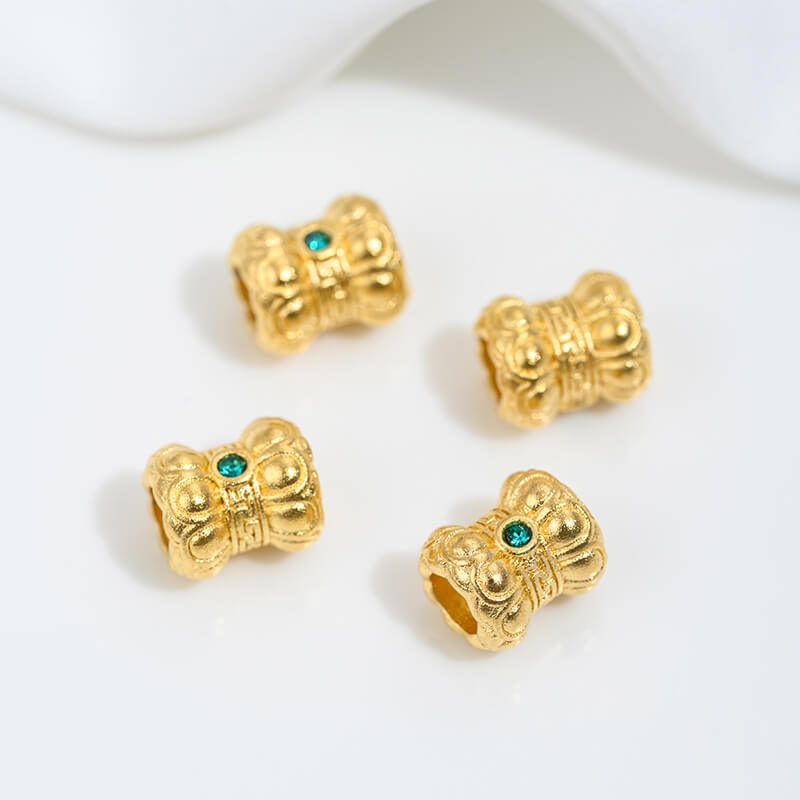 Sand gold inlaid with ruby and green diamonds, spacer beads
