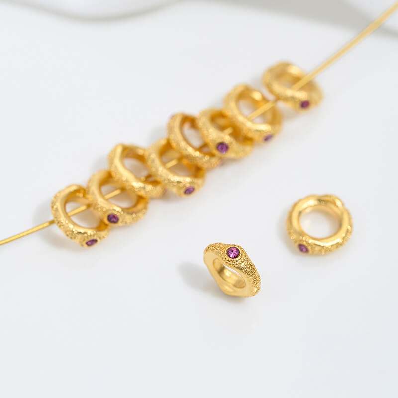 Sand gold inlaid with ruby and green diamonds, spacer beads