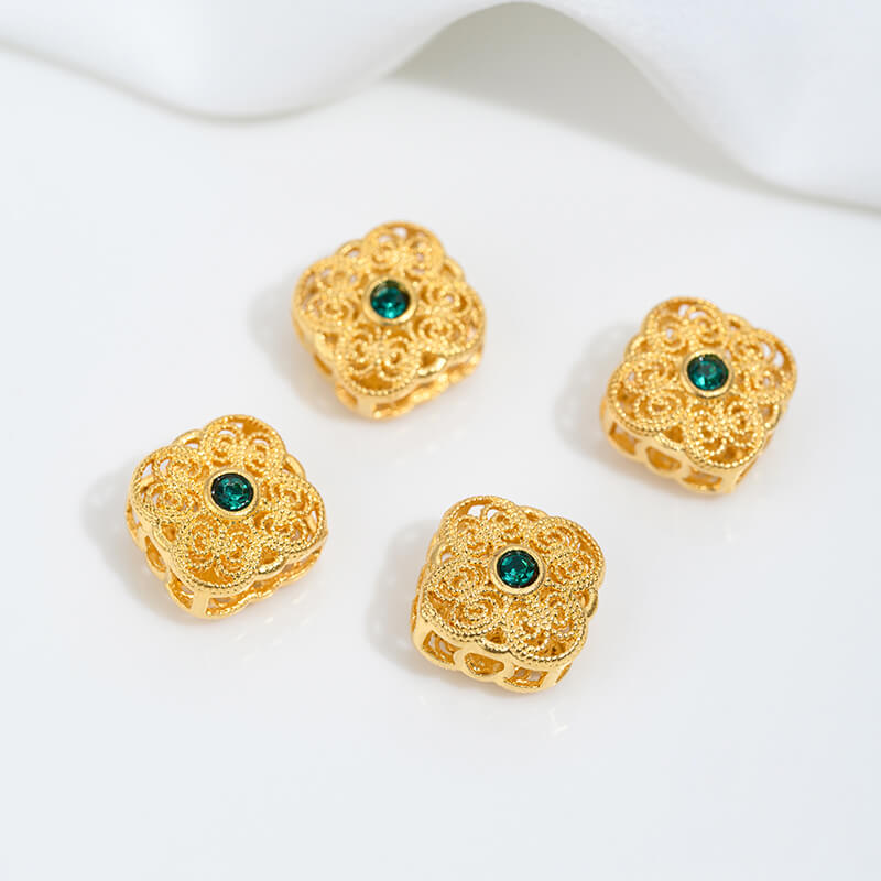 Sand gold inlaid with ruby and green diamonds, spacer beads