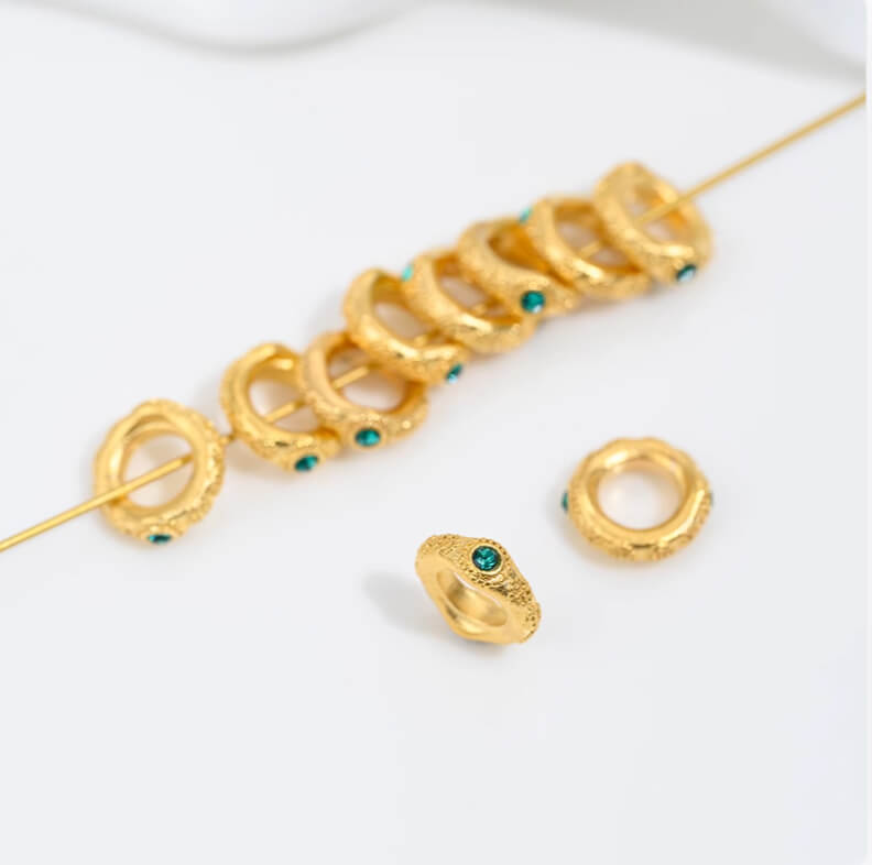 Sand gold inlaid with ruby and green diamonds, spacer beads