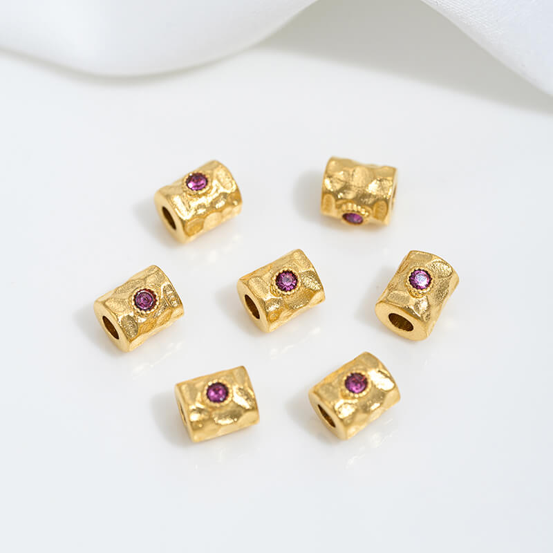 Sand gold inlaid with ruby and green diamonds, spacer beads