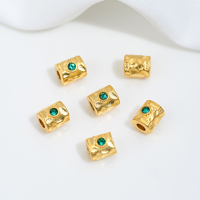 Sand gold inlaid with ruby and green diamonds, spacer beads