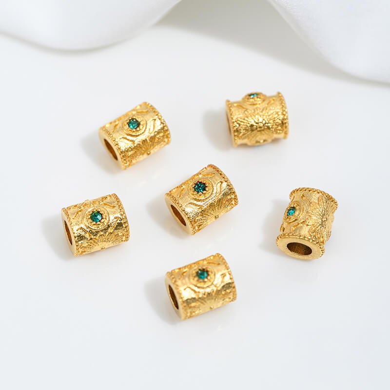 Sand gold inlaid with ruby and green diamonds, spacer beads