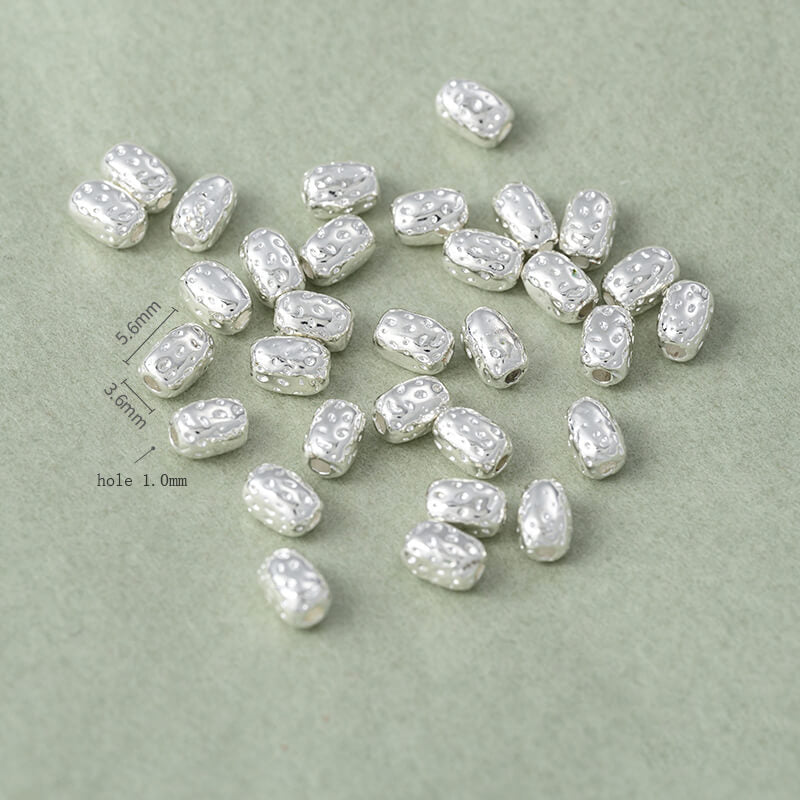 Copper-clad thick sterling silver irregular stone-shaped spacer beads
