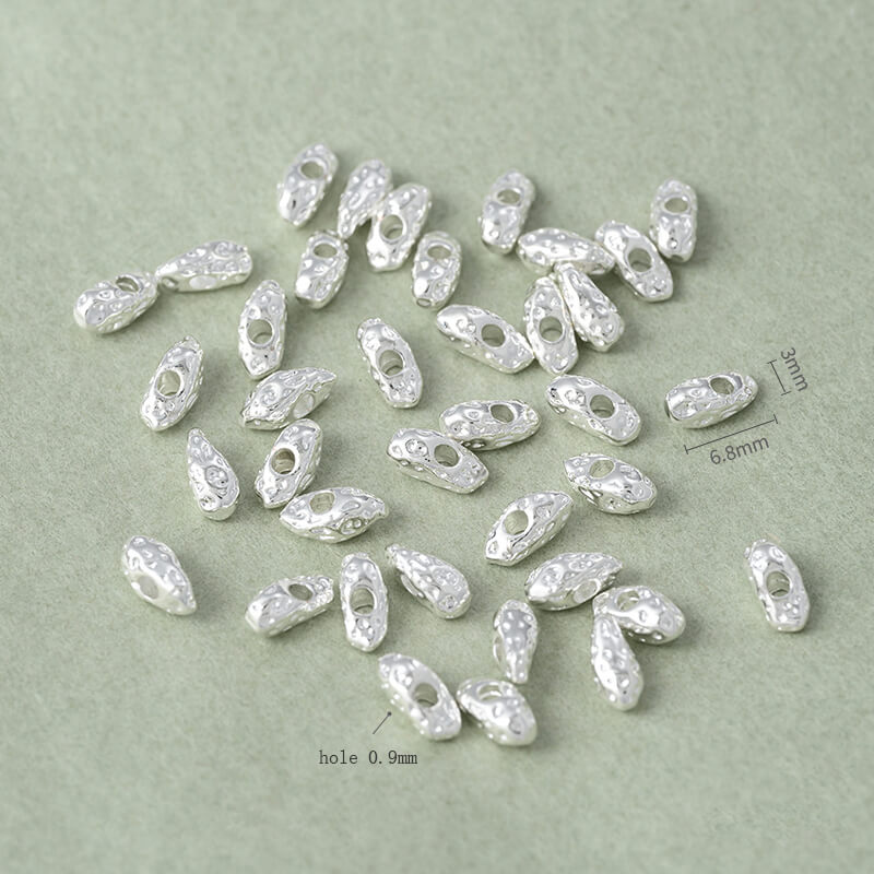 Copper-clad thick sterling silver irregular stone-shaped spacer beads