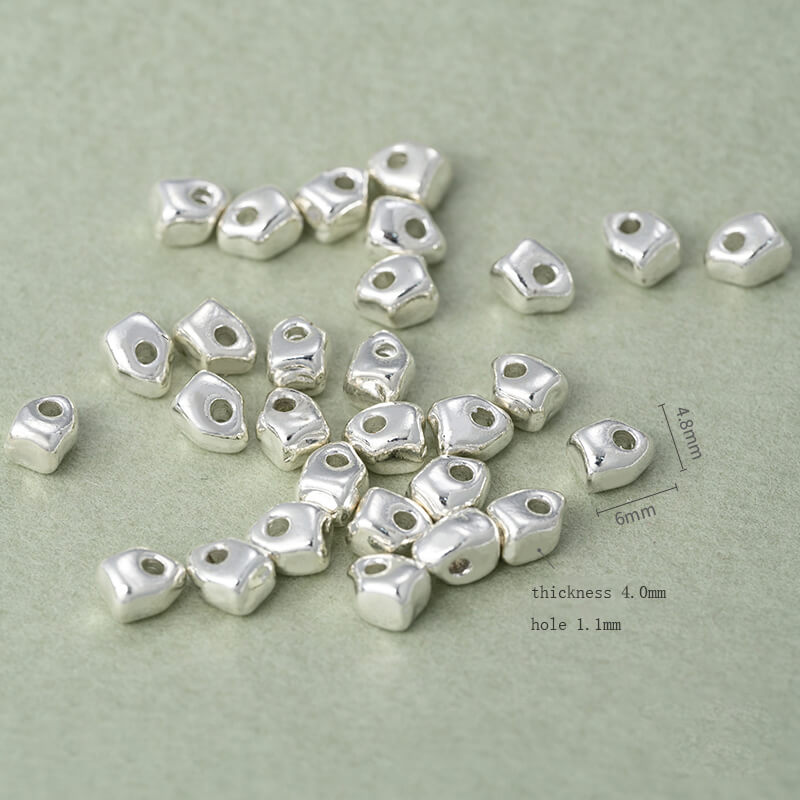 Copper-clad thick sterling silver irregular stone-shaped spacer beads