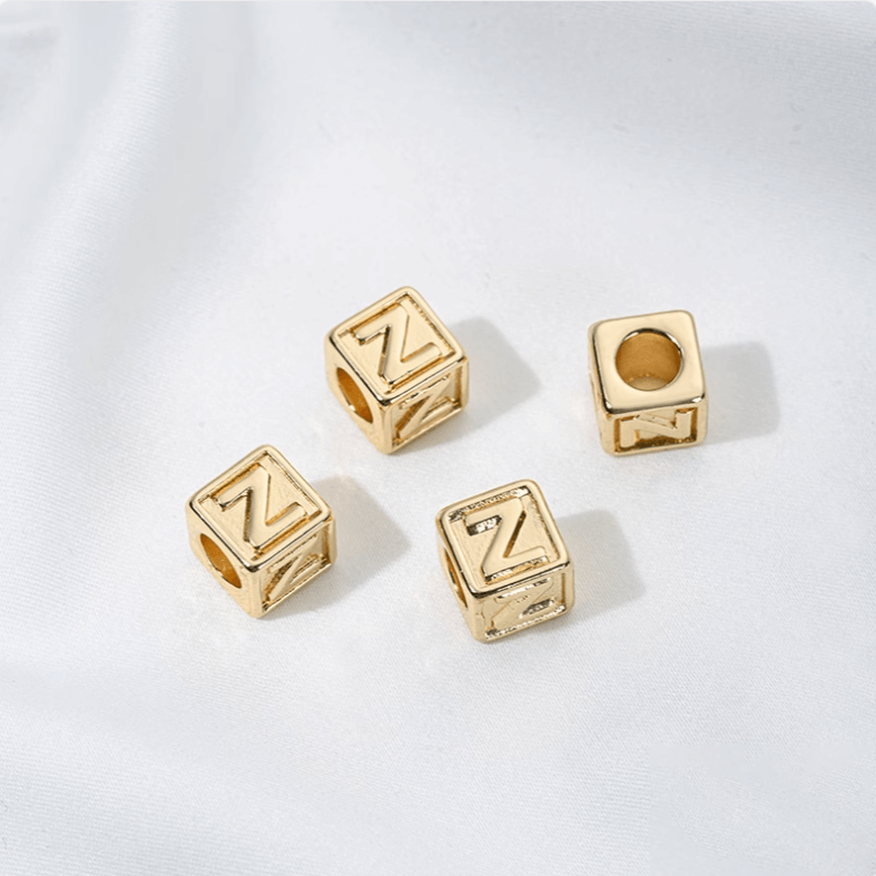 Titanium steel with gold-plated 26 letters square through-hole relief spacer