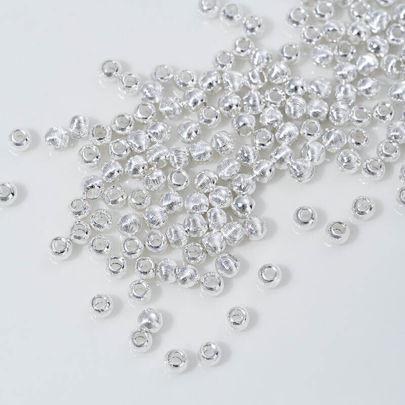 Fine patterned cat's eye faceted round beads with brushed spacer beads