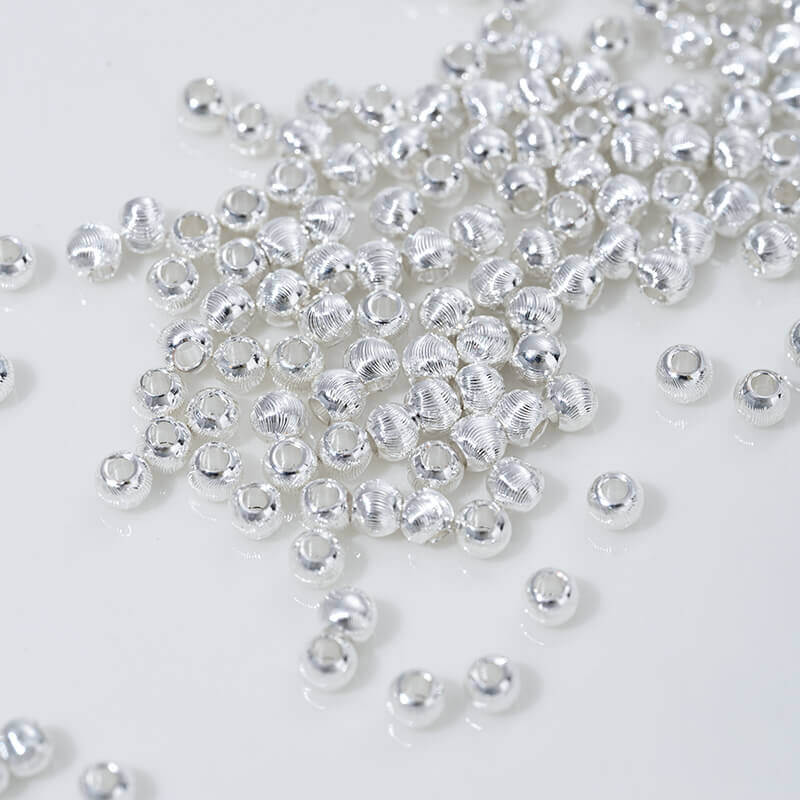 Fine patterned cat's eye faceted round beads with brushed spacer beads