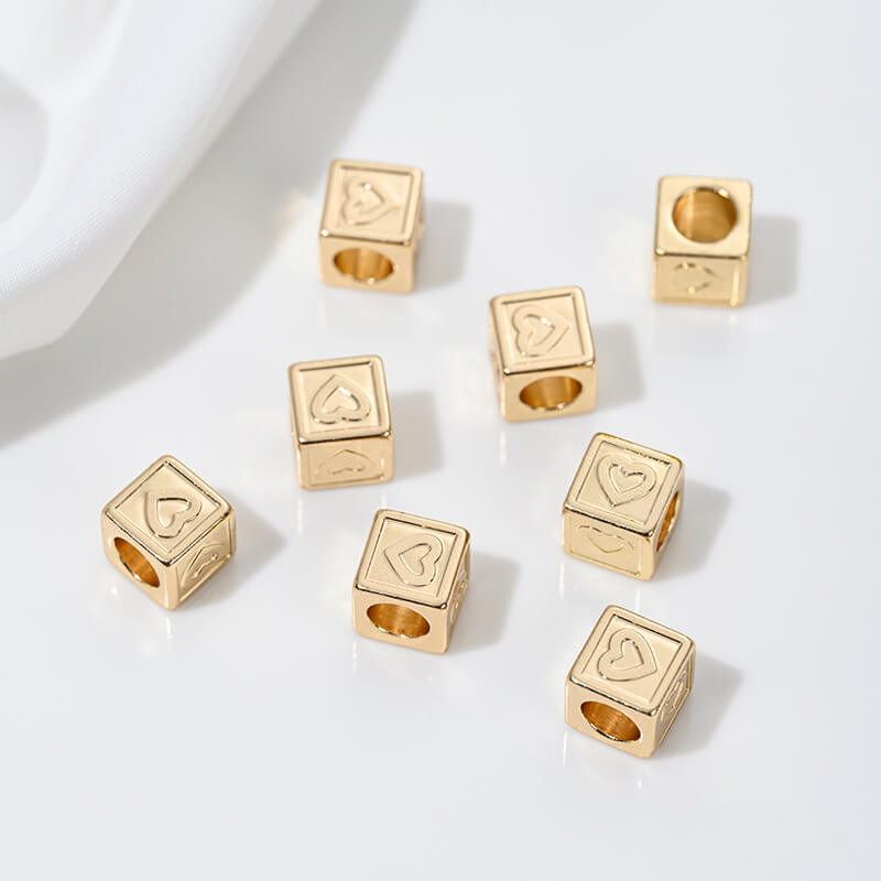 Titanium steel with gold-plated 26 letters square through-hole relief spacer