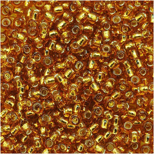 Toho Round Seed Beads 11/0 22C 'Silver Lined Topaz' 10 Gram Tube