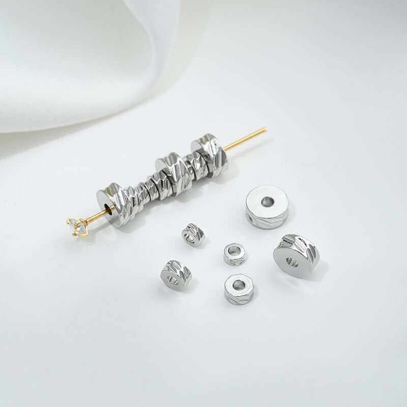 Cut-faced flat sheet spacer beads