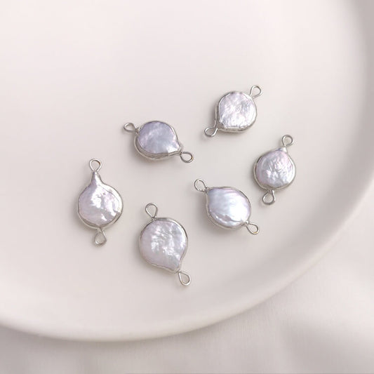 11×20mm natural baroque teardrop pearl double-hole connector in platinum plating.