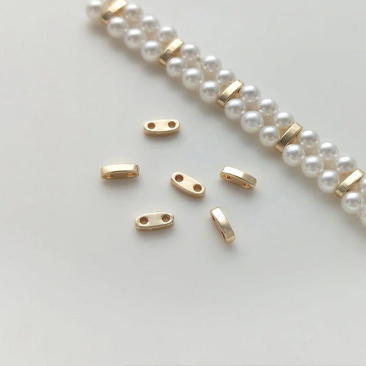 Double hole millet bead spacer