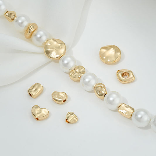 Irregular heart-shaped perforated spacer beads