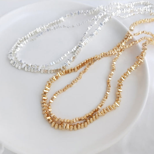 Small triangular gold and silver beads chain