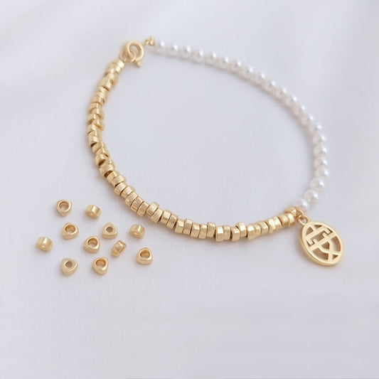 Triangular small gold spacer beads