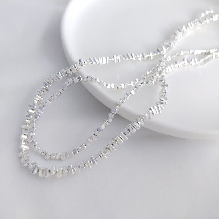 Small triangular gold and silver beads chain