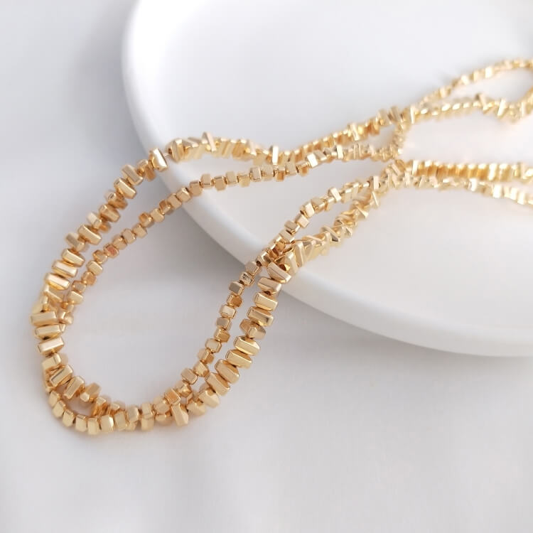 Small triangular gold and silver beads chain